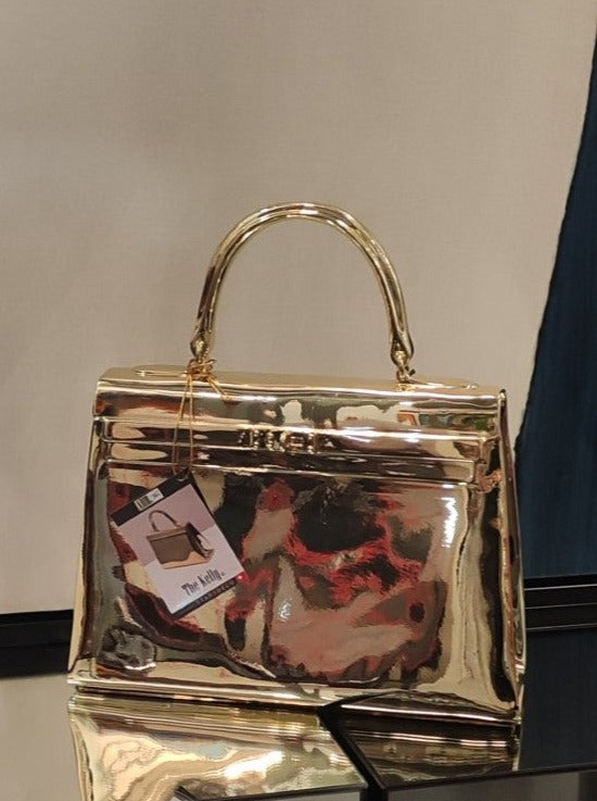 sac a main kelly gold